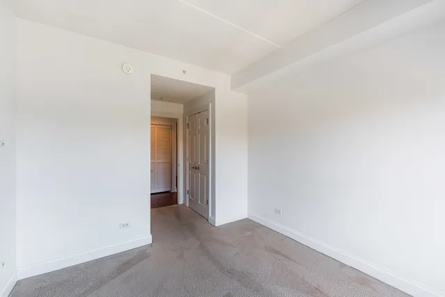 a view of an empty room and closet