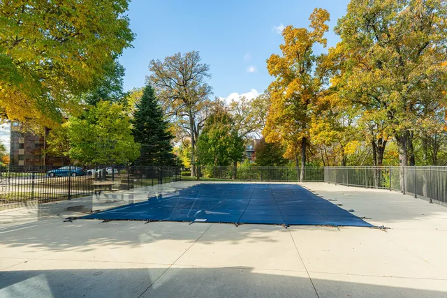 a view of backyard with large trees