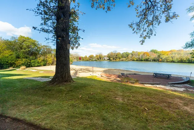 a view of a lake with sunset
