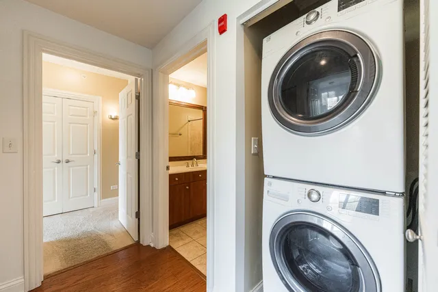 a view of a hallway with washer and dryer