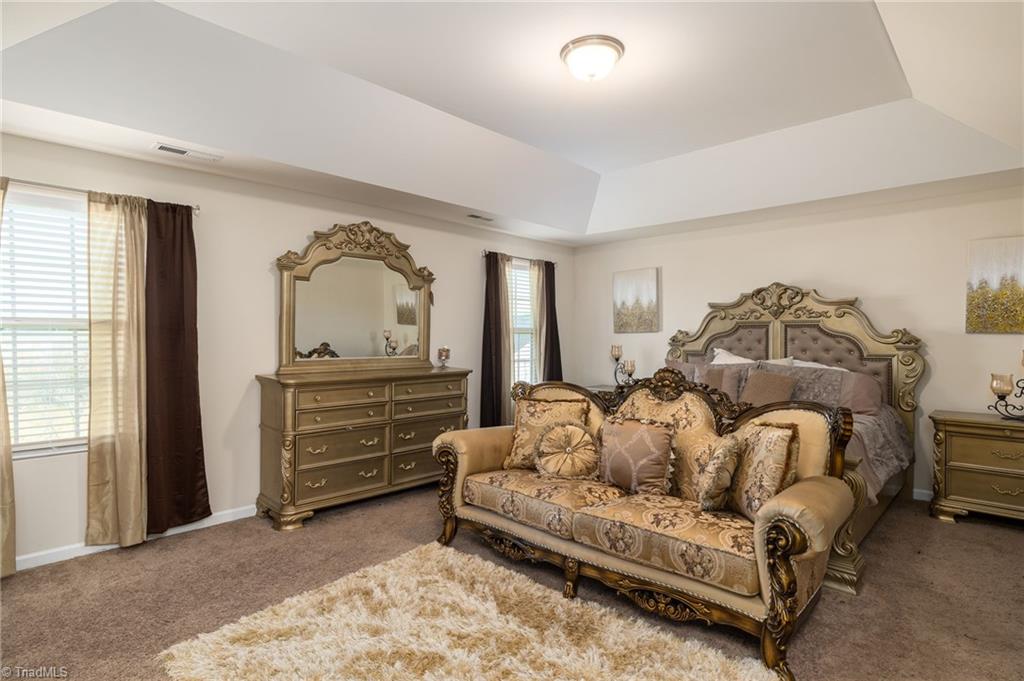 3637 Link Road Greensboro, NC 27405 - Photo 21 of 36 Stunning Primary Bedroom provides plenty of space for a King size bed and all your furniture.