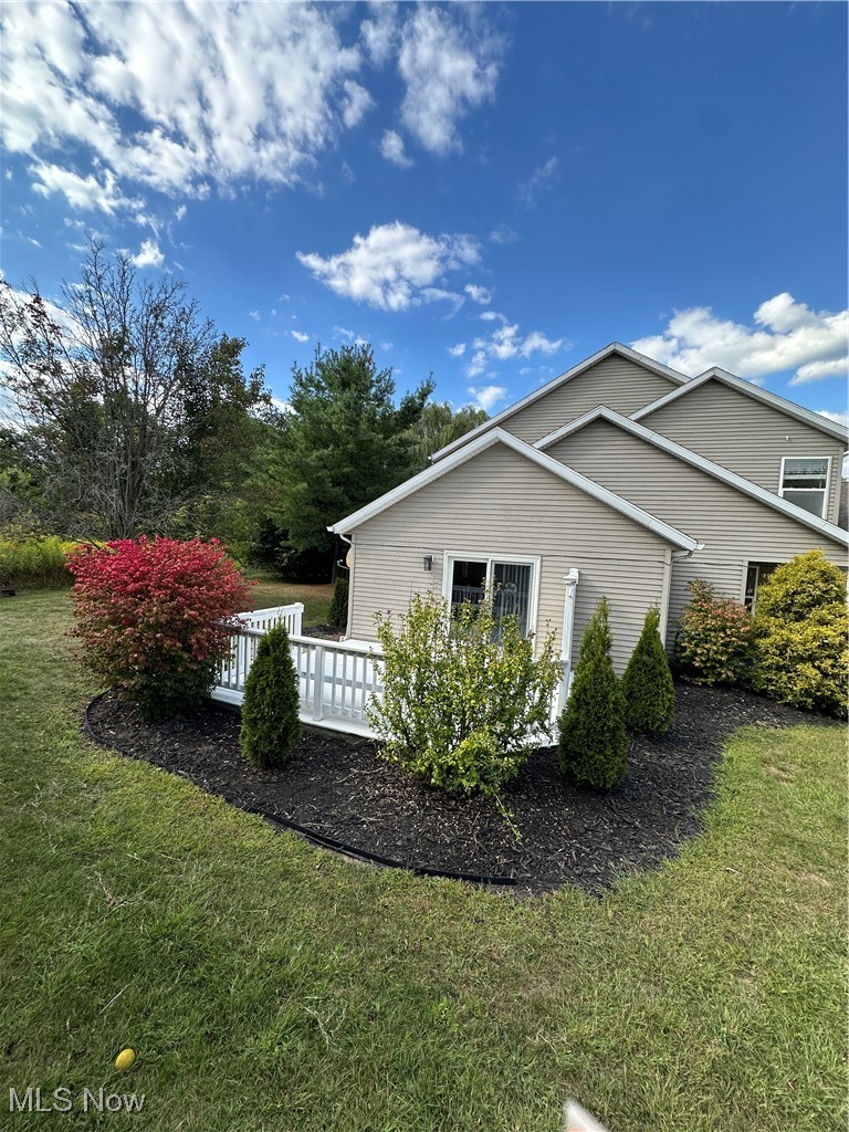 5205 Cline Road, Unit A Kent, OH 44240 - Photo 16 of 23 View of home's exterior with a yard and a deck