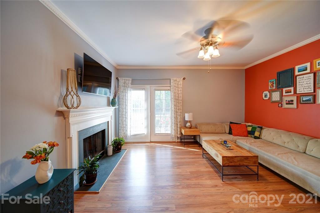 1014 Queens Road Charlotte, NC 28207 - Photo 12 of 18 a living room with furniture fireplace and flat screen tv
