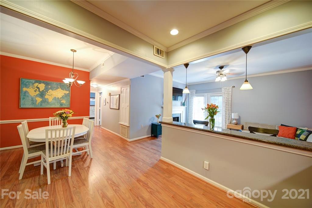 1014 Queens Road Charlotte, NC 28207 - Photo 15 of 18 a dining room with furniture and a wooden floor