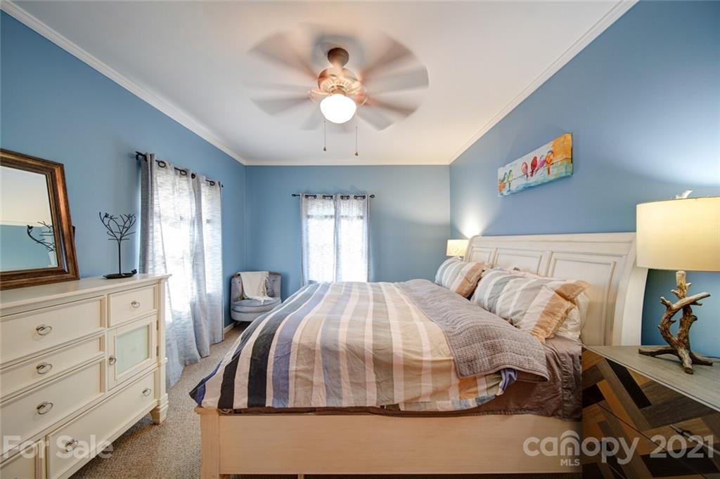 1014 Queens Road Charlotte, NC 28207 - Photo 4 of 18 a bedroom with a bed and a dresser