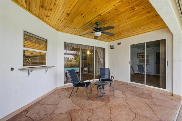 a view of a swimming pool with a patio