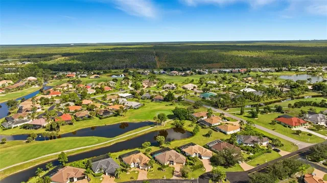 a view of a golf course with a lake view