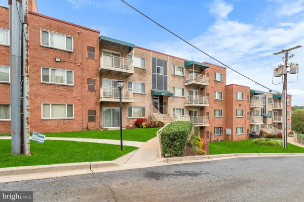 a view of a building with a yard