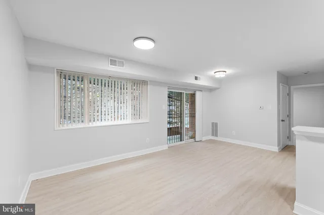 a view of an empty room with a window