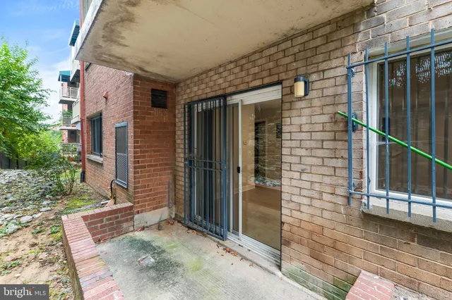 a view of a brick house with a large window