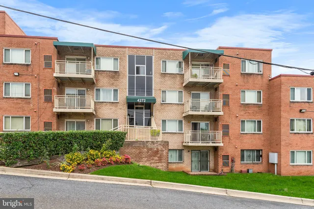 a view of a building with a yard