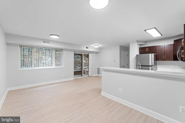 a view of kitchen with sink and window