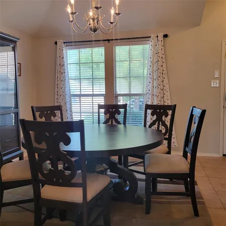 a view of a dining room with furniture window and outside view