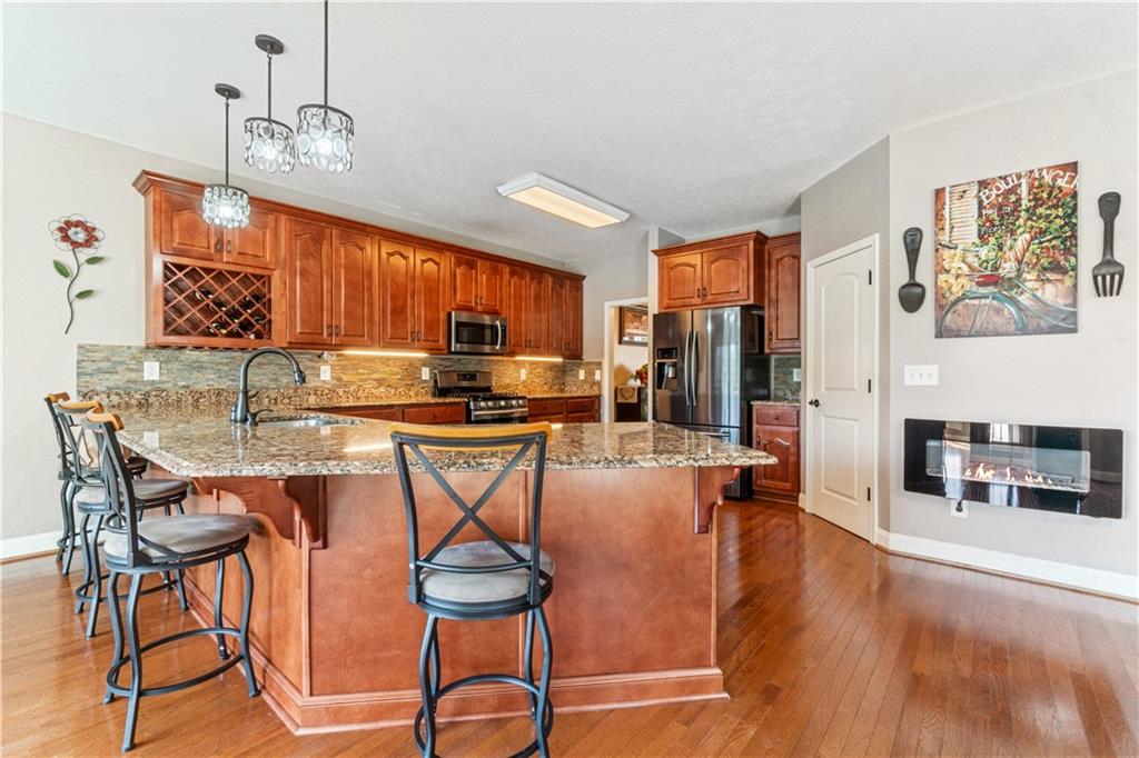 1401 Rainey Road Temple, GA 30179 - Photo 14 of 58 a dinning room and kitchen with a table chairs