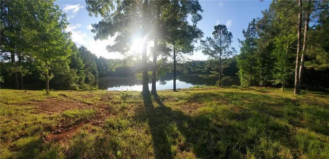 a view of a lake with a yard