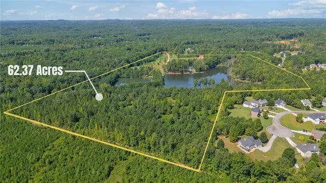 a kitchen with stainless steel appliances a stove a sink a refrigerator cabinets and dining table