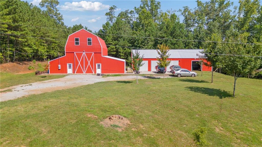 1401 Rainey Road Temple, GA 30179 - Photo 38 of 58 a front view of a house with garden