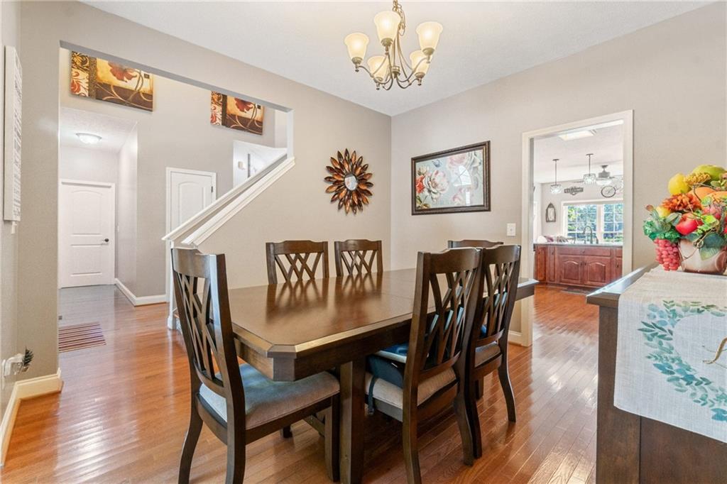 1401 Rainey Road Temple, GA 30179 - Photo 39 of 58 a view of a dining room with furniture and wooden floor