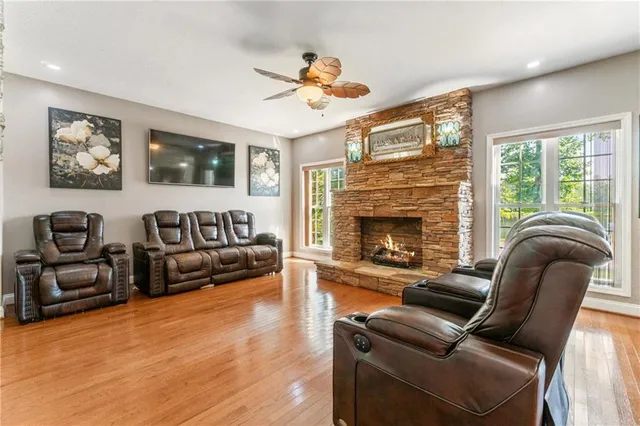 a view of a hallway with workspace and wooden floor