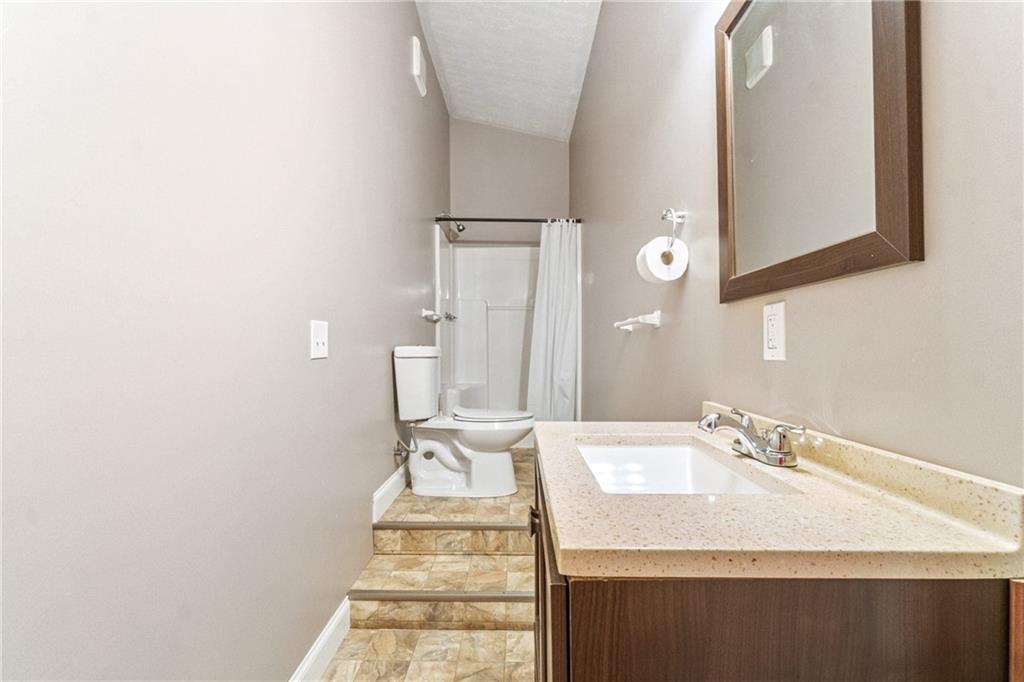 1401 Rainey Road Temple, GA 30179 - Photo 51 of 58 a bathroom with a sink and a mirror