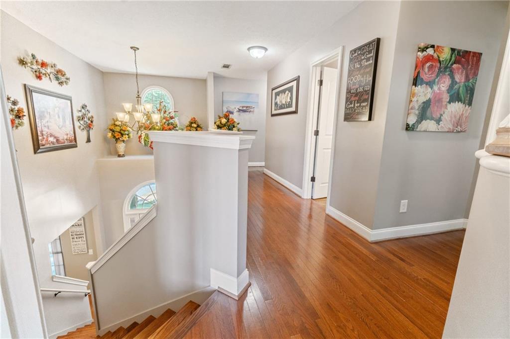 1401 Rainey Road Temple, GA 30179 - Photo 52 of 58 a view of a hallway with workspace and wooden floor