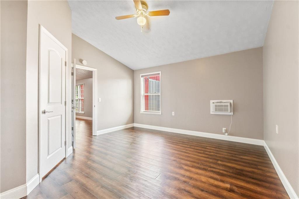 1401 Rainey Road Temple, GA 30179 - Photo 54 of 58 a view of an empty room with wooden floor