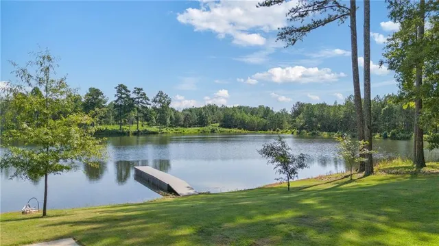 a view of a lake with a big yard