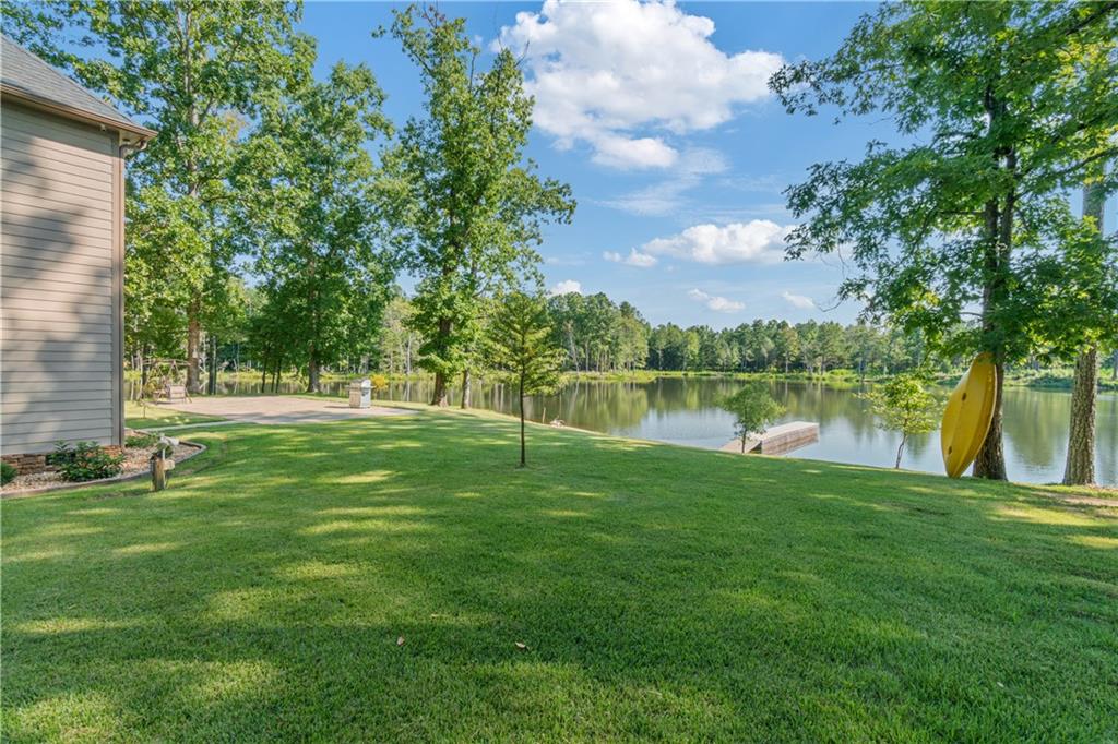 1401 Rainey Road Temple, GA 30179 - Photo 8 of 58 a view of a lake with a big yard