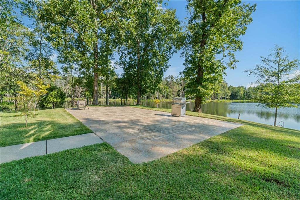 1401 Rainey Road Temple, GA 30179 - Photo 9 of 58 a view of a backyard with large trees