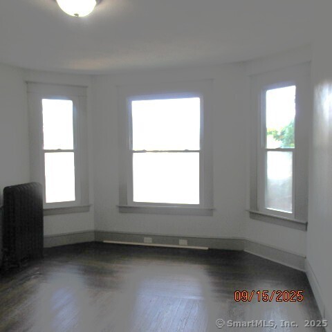 67 Burlington Avenue, Unit 69 Bristol, CT 06010 - Photo 6 of 15 an empty room with a window