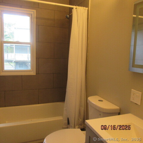 67 Burlington Avenue, Unit 69 Bristol, CT 06010 - Photo 9 of 15 a bathroom with a toilet and a bath tub