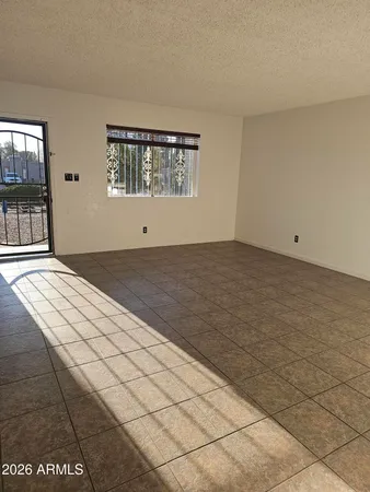 a view of an empty room and window