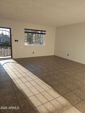 a view of an empty room and window