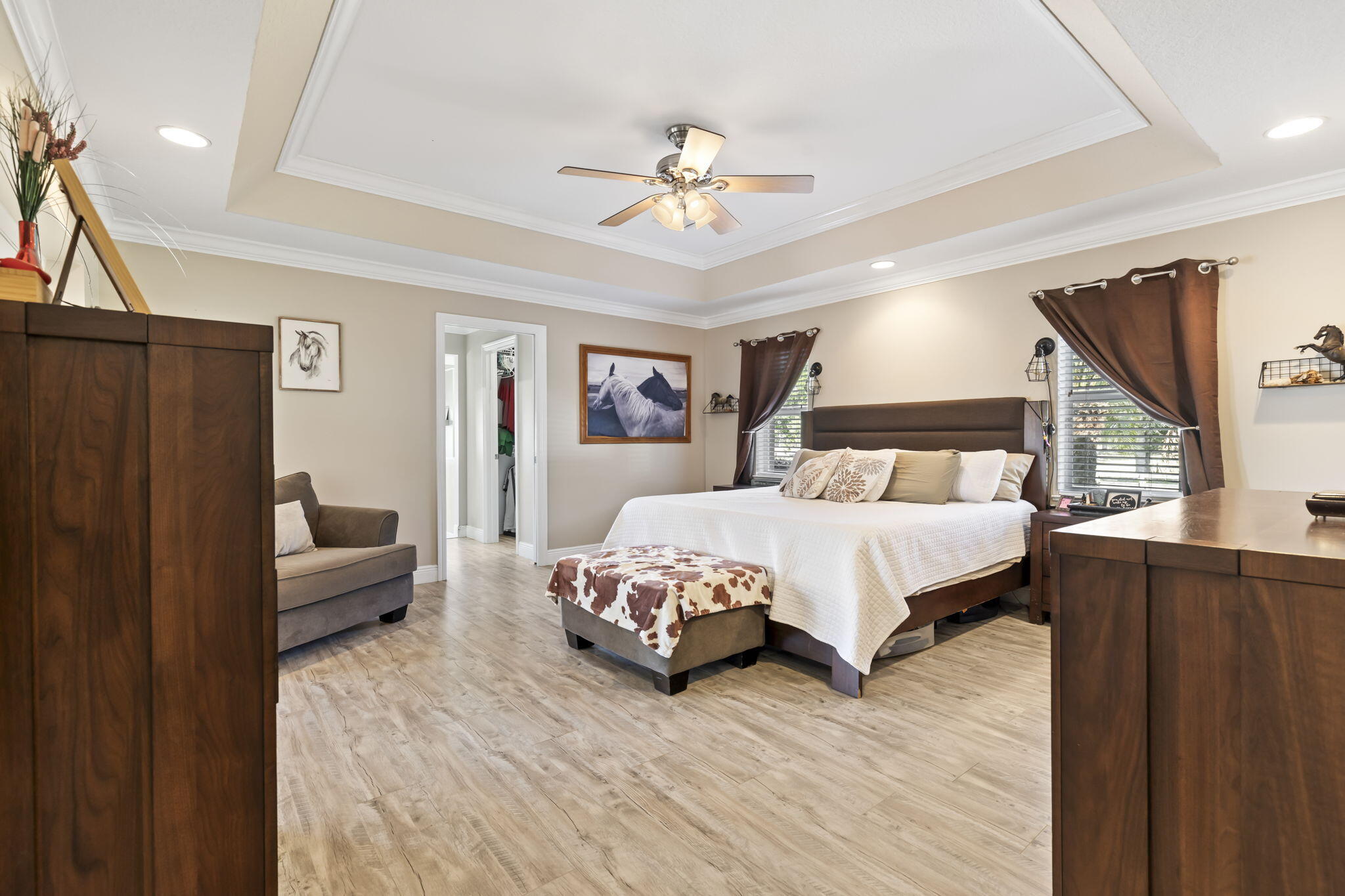 9850 Muller Road Fort Pierce, FL 34945 - Photo 18 of 52 a bed sitting in a spacious bedroom next to a window