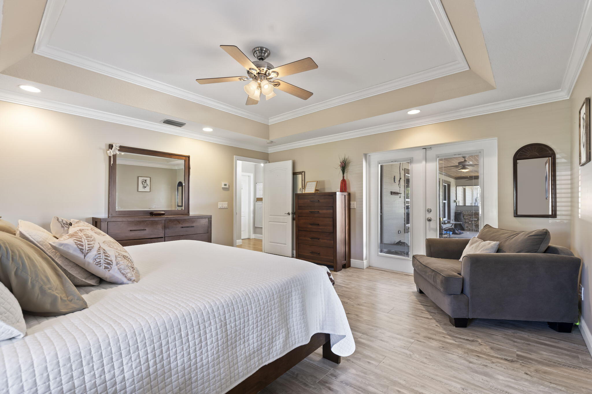 9850 Muller Road Fort Pierce, FL 34945 - Photo 19 of 52 a bedroom with a bed and ceiling fan