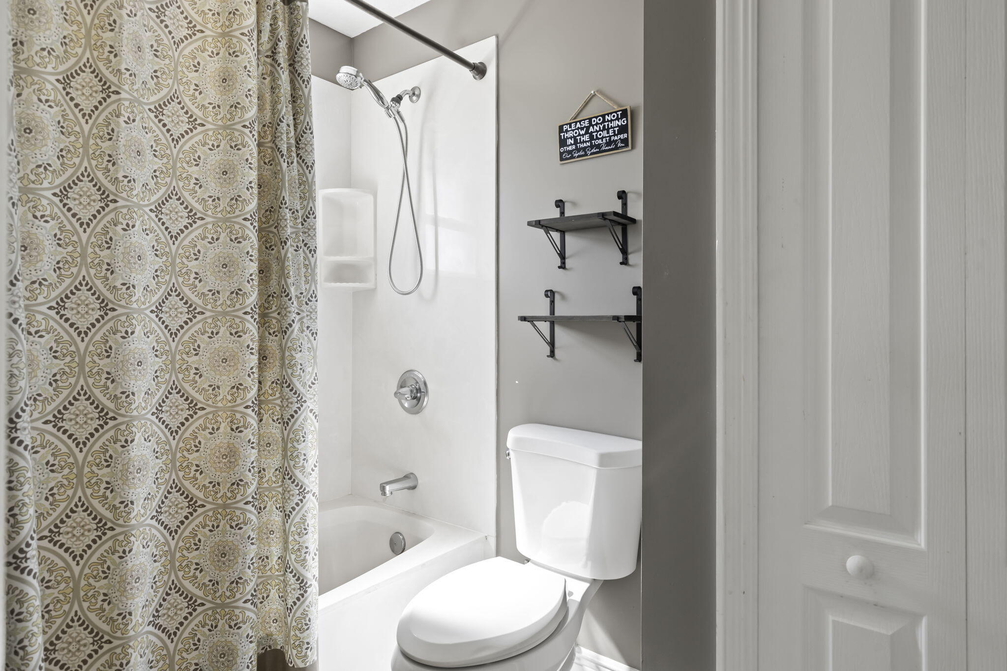 9850 Muller Road Fort Pierce, FL 34945 - Photo 26 of 52 a white toilet sitting next to a bathroom sink