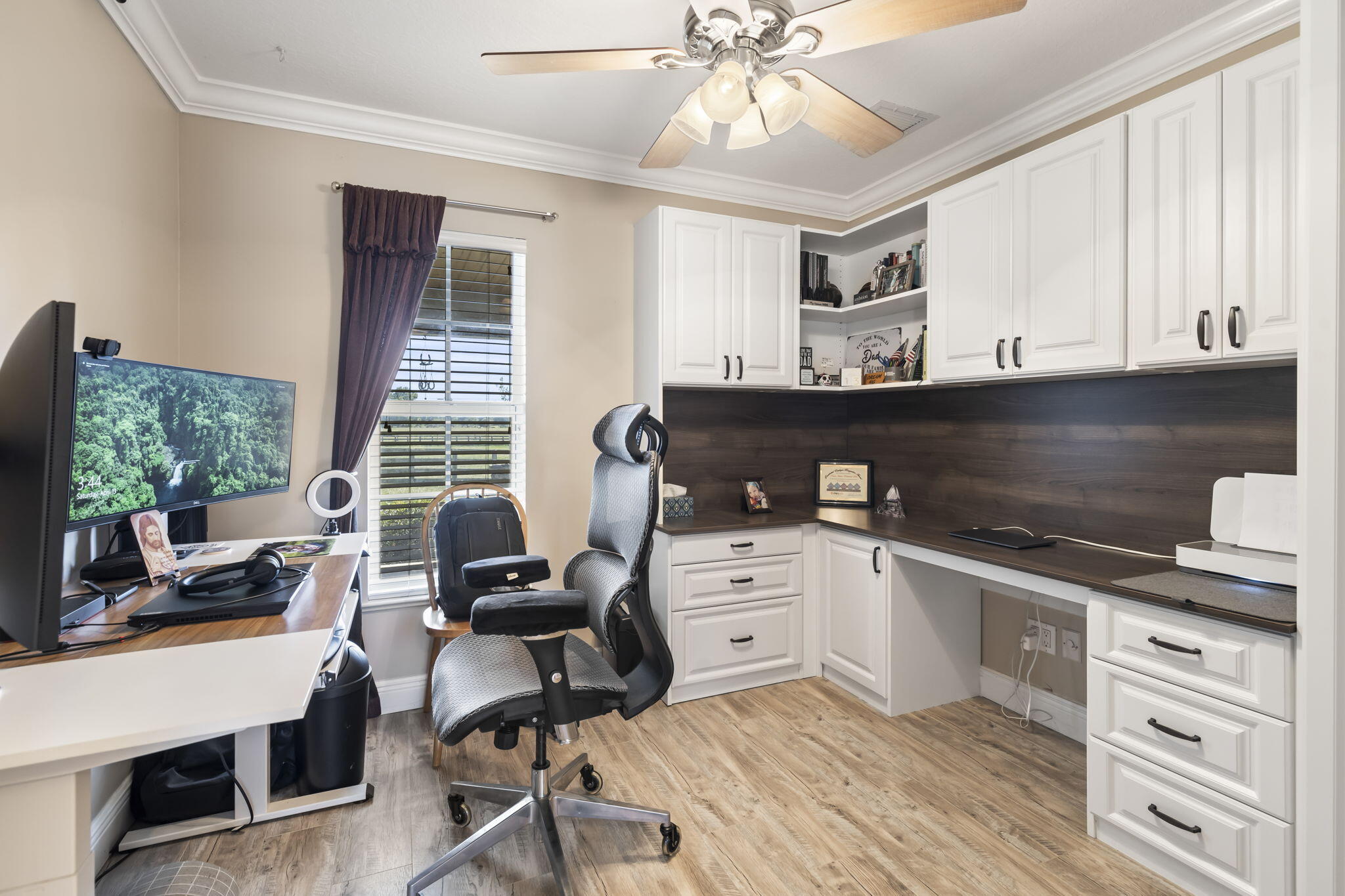 9850 Muller Road Fort Pierce, FL 34945 - Photo 29 of 52 a kitchen with a stove a refrigerator and cabinets