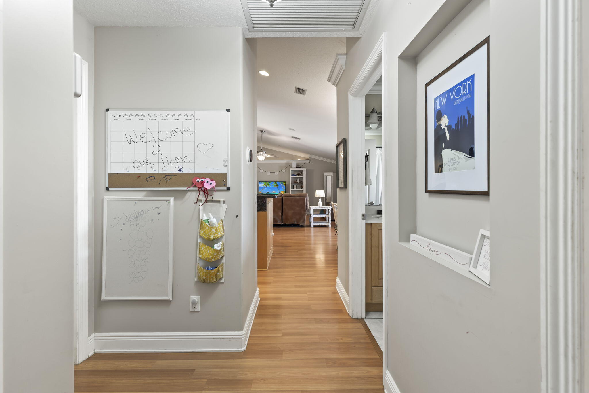 9850 Muller Road Fort Pierce, FL 34945 - Photo 31 of 52 a view of a hallway with wooden floor windows