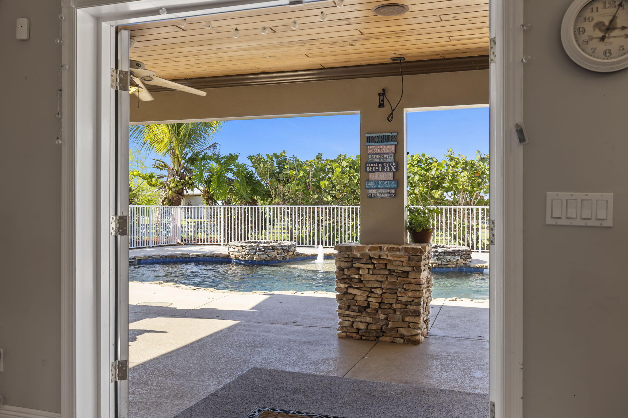 9850 Muller Road Fort Pierce, FL 34945 - Photo 32 of 52 a view of water heater room with wooden floor