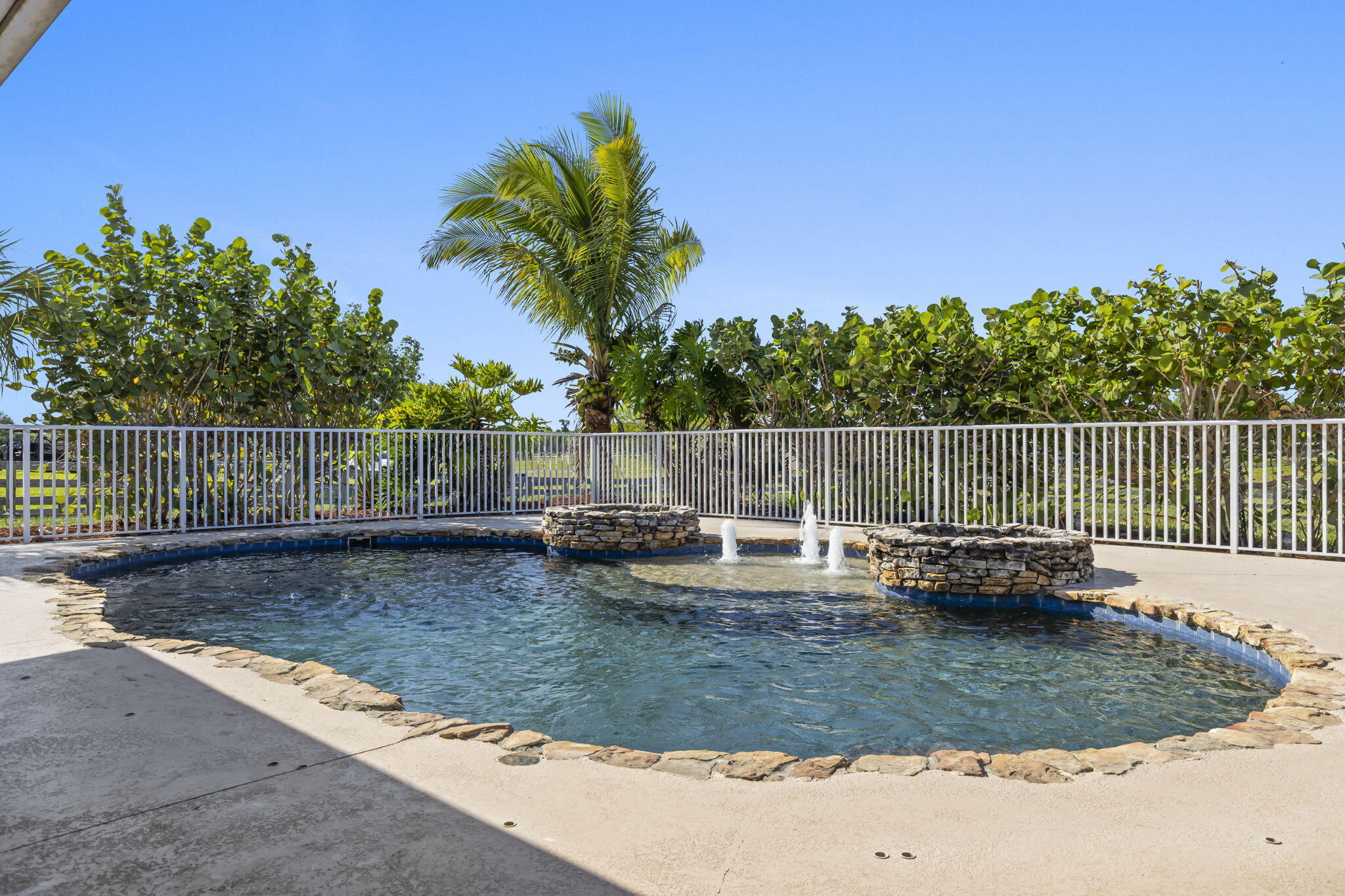 9850 Muller Road Fort Pierce, FL 34945 - Photo 34 of 52 a view of a backyard with swimming pool and furniture