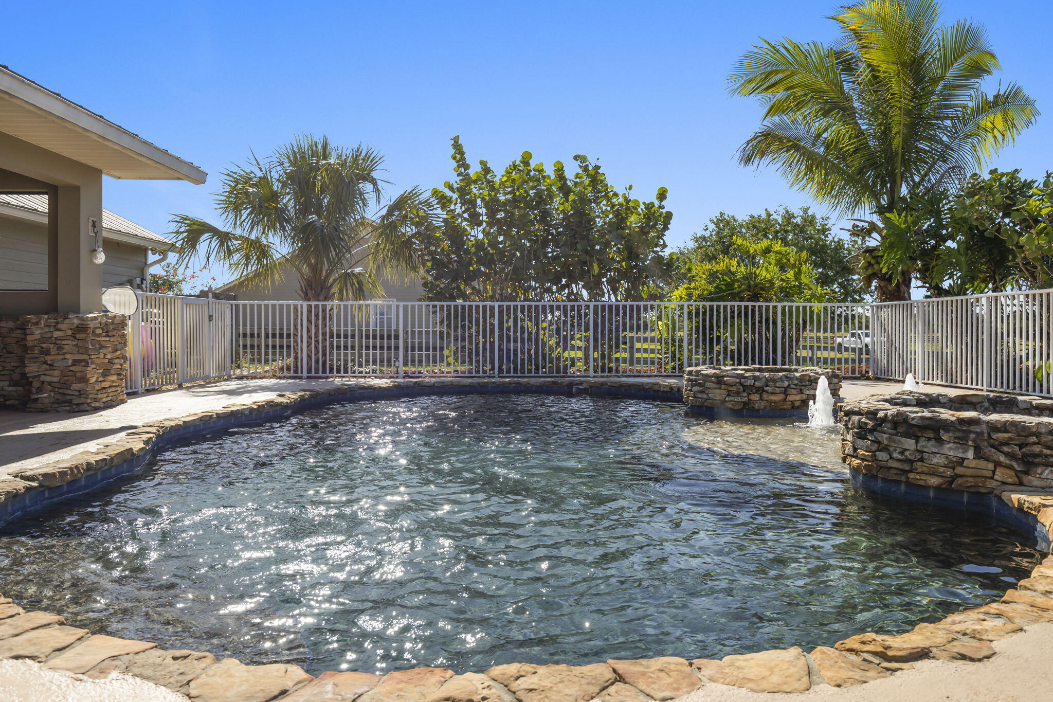 9850 Muller Road Fort Pierce, FL 34945 - Photo 35 of 52 a view of a backyard with a fountain