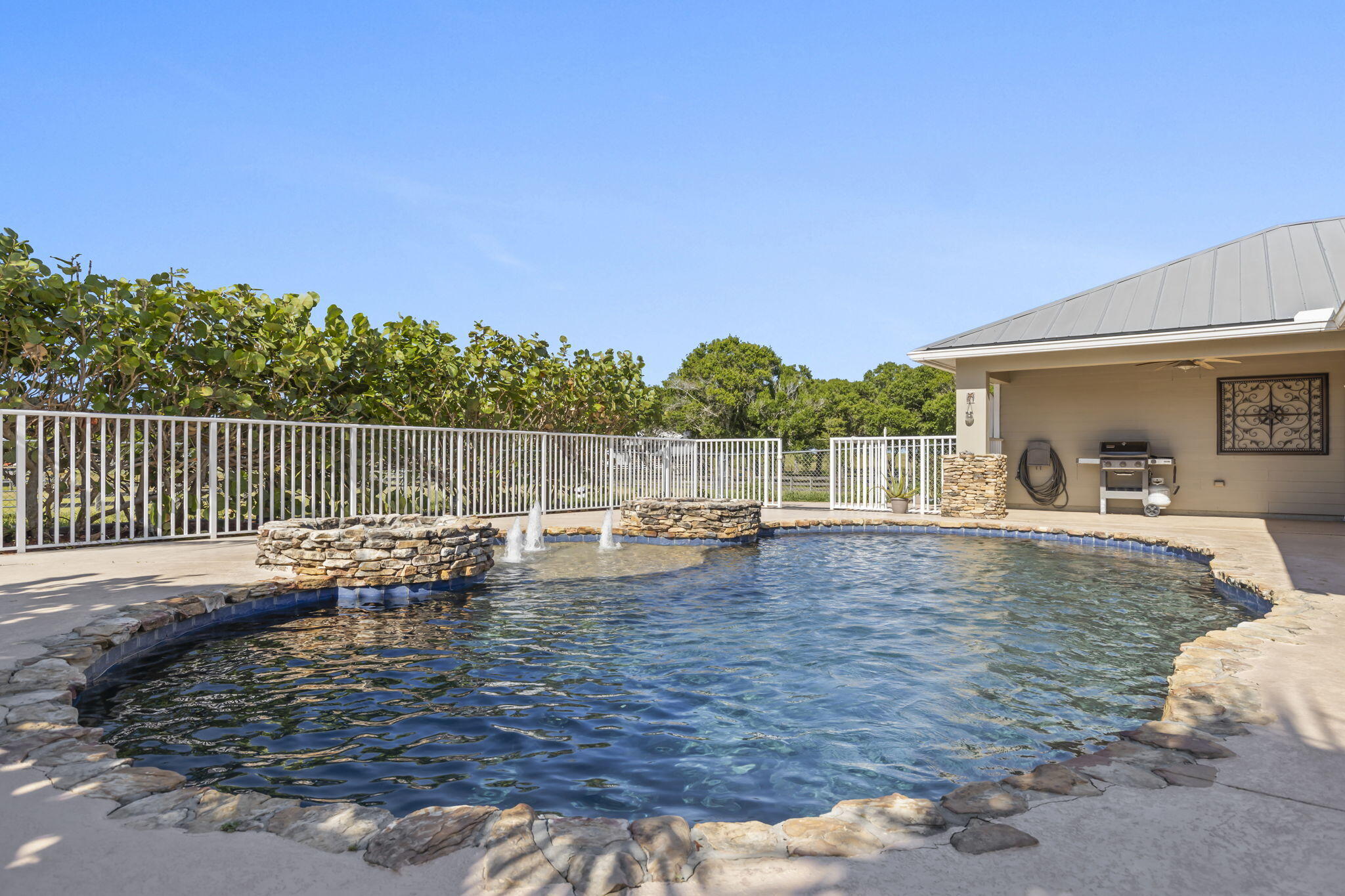 9850 Muller Road Fort Pierce, FL 34945 - Photo 37 of 52 a view of swimming pool with sitting area