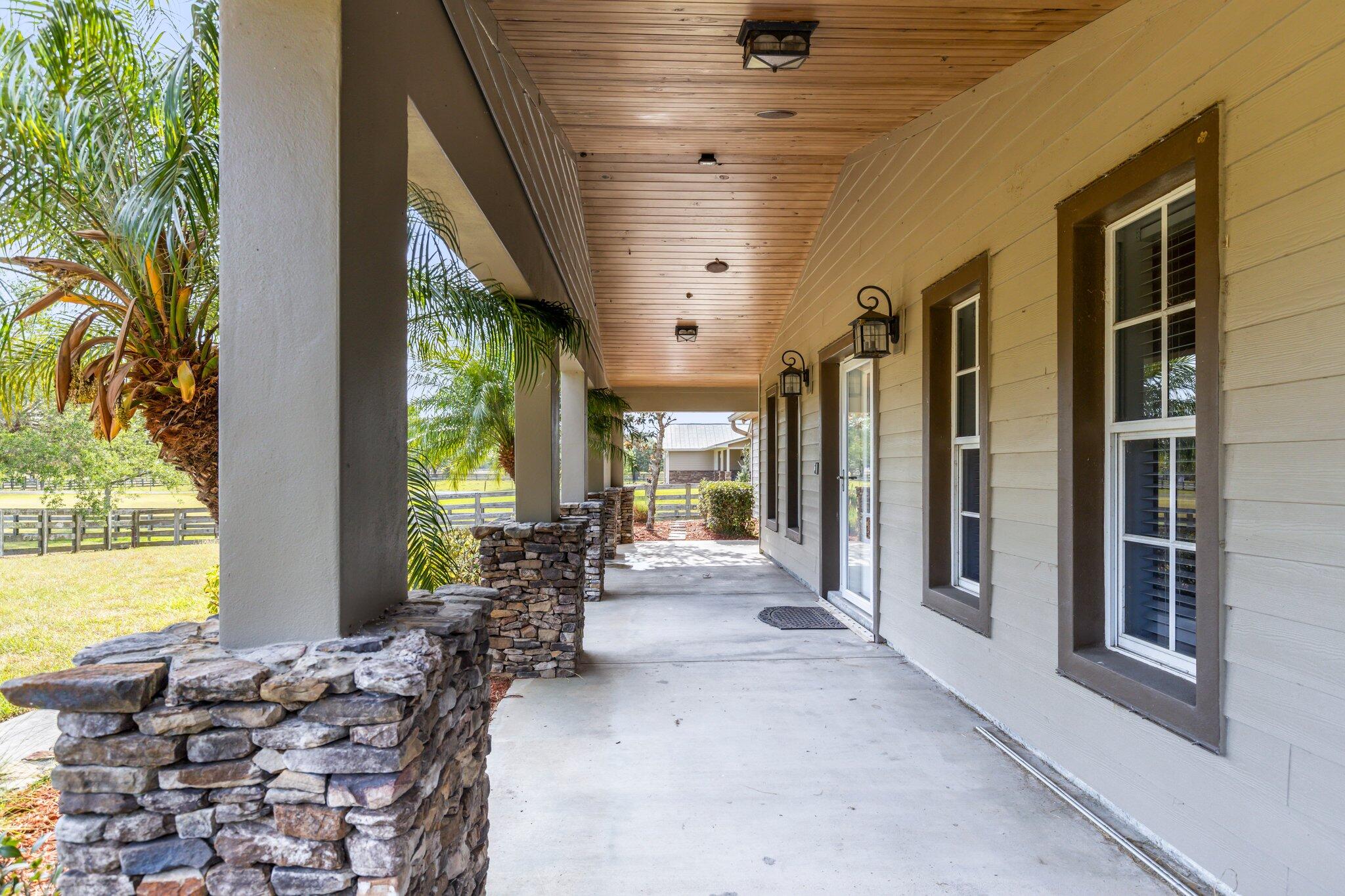 9850 Muller Road Fort Pierce, FL 34945 - Photo 4 of 52 a building outdoor space with furniture