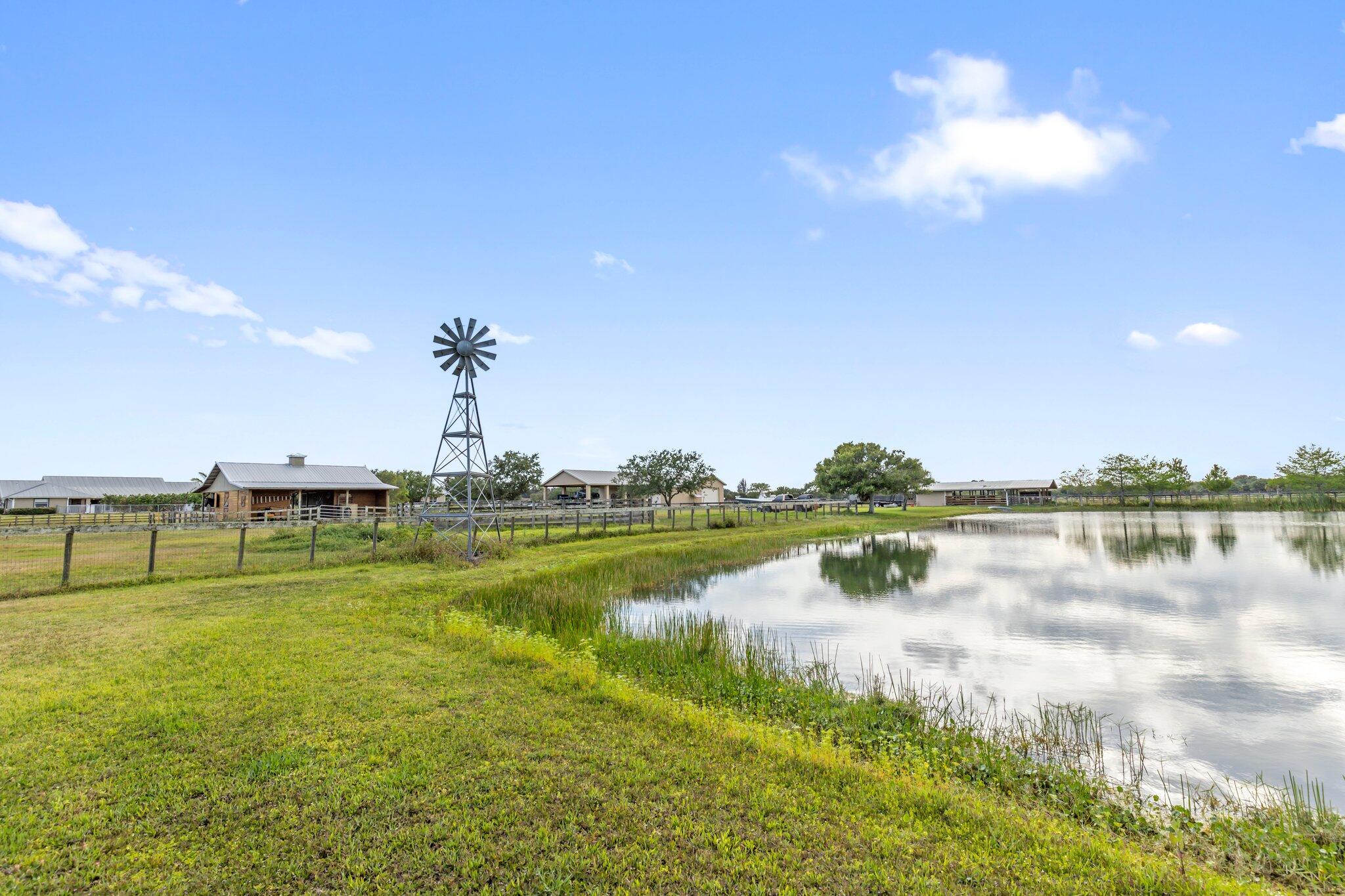 9850 Muller Road Fort Pierce, FL 34945 - Photo 47 of 52 a view of a lake with a big yard