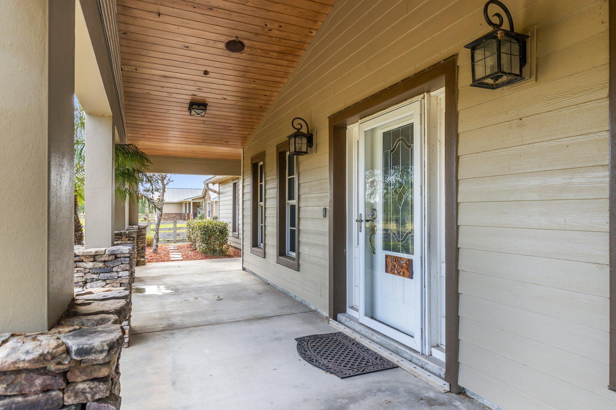 9850 Muller Road Fort Pierce, FL 34945 - Photo 5 of 52 a view of a porch with seating space