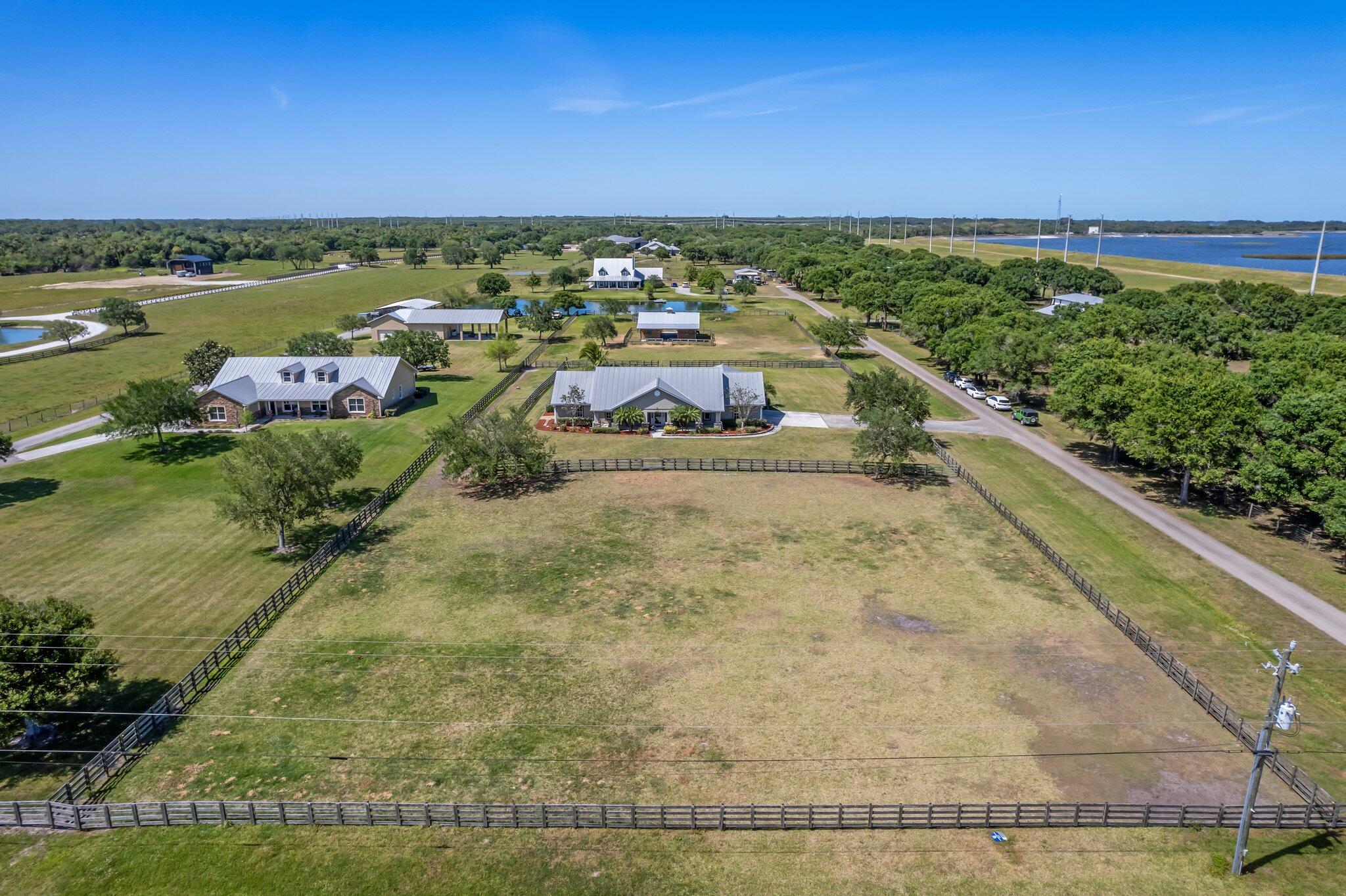 9850 Muller Road Fort Pierce, FL 34945 - Photo 51 of 52 a view of a swimming pool with a yard