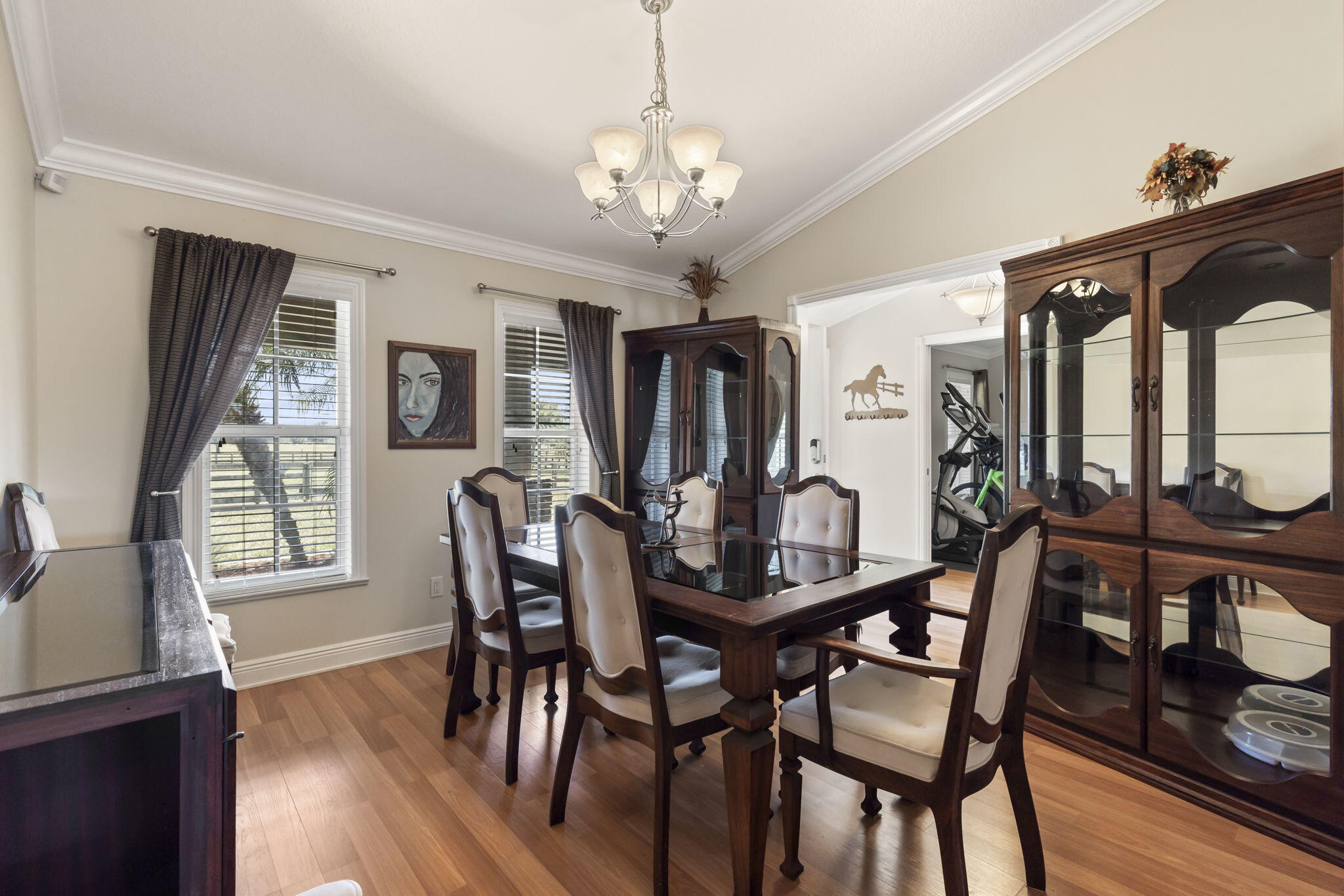 9850 Muller Road Fort Pierce, FL 34945 - Photo 7 of 52 a view of a dining room with furniture window and wooden floor