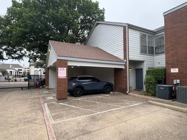 a car parked in front of a house