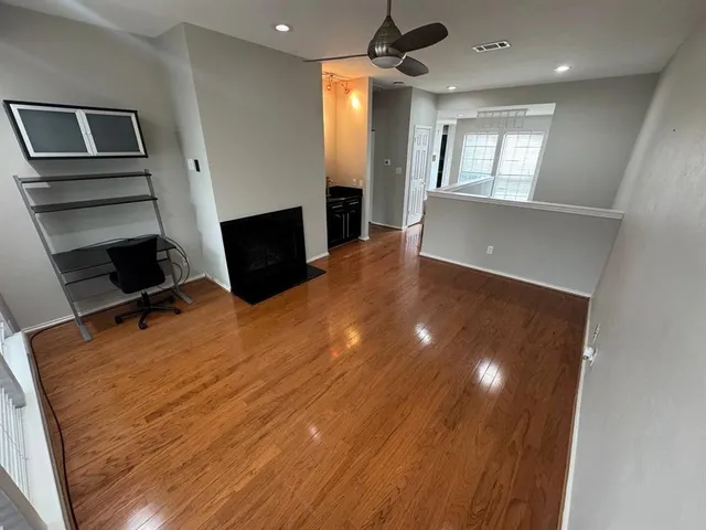 a bedroom with a bed and a television