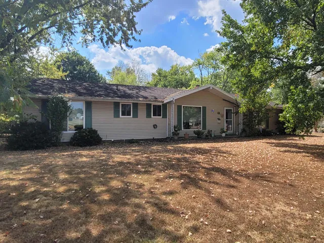 a house with trees in the background